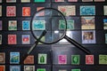 Philately magnifying glass and tweezers ready to see stamp collection Royalty Free Stock Photo