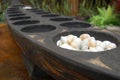 Philippine mancala sungka game consists of wooden board and seed shells Royalty Free Stock Photo