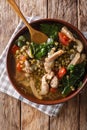 Philippine mung beans soup with pork closeup in a bowl. Vertical Royalty Free Stock Photo