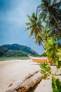 Philippines beach landscape - Local banca boat under palm trees at Corong Corong beach in El Nido, Palawan island Royalty Free Stock Photo
