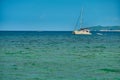 Philippines, Boracay island, Puka Beach. A white yacht is moored in the sea with a white rubber boat attached. Against Royalty Free Stock Photo