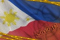 Philippines flag and Covid-19 biohazard symbol with quarantine orange tape and stamp. Coronavirus or 2019-nCov virus concept