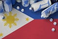 Philippines flag and few used aerosol spray cans for graffiti painting. Street art culture concept