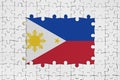 Philippines flag in frame of white puzzle pieces with missing central part