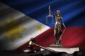 Philippines flag with statue of lady justice, constitution and judge hammer on black drapery. Concept of judgement and