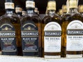 Philippines -Close-up of Bushmills Black Bush and The Original Irish whiskey bottles lined up on a retail shelf