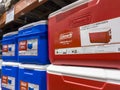 Philippines - Rows of Coleman-brand red and blue coolers on display at a hypermart warehouse, indicating outdoor