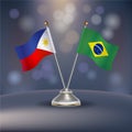 Philippines VS Brazil flag Relation in a stand on table Royalty Free Stock Photo