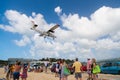 Philipsburg, Sint Maarten - February 13, 2016: wanderlust, travel and trip. Plane land over maho beach. Jet flight low fly on clou Royalty Free Stock Photo