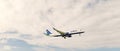 Philipsburg, Sint Maarten - January 24, 2016: jet on flight in clouds. Aircraft fly on cloudy sky. Plane on sunny day Royalty Free Stock Photo