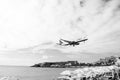 Philipsburg, Sint Maarten - January 24, 2016: jet flight low fly over maho beach. Plane land on cloudy sky. Airplane Royalty Free Stock Photo