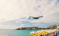 Philipsburg, Sint Maarten - January 24, 2016: jet flight low fly over maho beach. Plane land on cloudy sky. Airplane Royalty Free Stock Photo