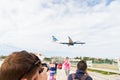 Philipsburg, Sint Maarten - January 24, 2016: vacation on maho beach at Caribbean. Plane low fly over people. Jet flight land on c