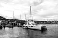 Philipsburg, Sint Maarten - January 24, 2016: yacht anchored at sea pier. People sit on modern ship deck. Luxury travel