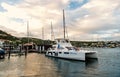 Philipsburg, Sint Maarten - January 24, 2016: yacht anchored at sea pier. People sit on modern ship deck. Luxury travel