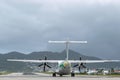 Air Antilles medium twin turbo-prop regional aircraft ATR 42-500 on runway Royalty Free Stock Photo