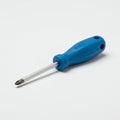 Phillips screwdriver with a blue plastic handle and a metallic shaft. The handle feature Royalty Free Stock Photo