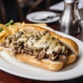 Philly steak sandwich with melted cheese top view. Fast food beef brisket sandwich. Royalty Free Stock Photo