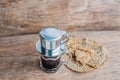 `Phin` traditional Vietnamese coffee maker, place on the top of glass, add ground coffee then pour hot water and wait until the co Royalty Free Stock Photo