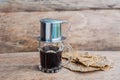 `Phin` traditional Vietnamese coffee maker, place on the top of glass, add ground coffee then pour hot water and wait until the co Royalty Free Stock Photo