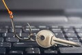 Phishing, hacking personal data and money , key and hook on computer keyboard