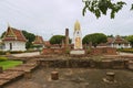 Ruins and Buddha statue at Wat Phra Sri Rattana Mahathat Woramahawihan temple in Phitsanulok, Thailand.