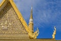 Classic Khmer roofs and ornate gilding of The Throne Hall of the Royal palace