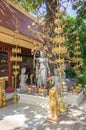 Group of statues under the cannonball tree in a compound of the Royal palace