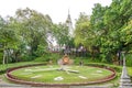 The main stupa, garden and the statue of King Sisowath in the W