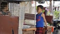 Phnom Penh, Cambodia - circa January 2024: local child playing in a tuk tuk Royalty Free Stock Photo