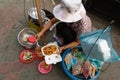 Woman serving traditional Asian street food