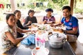 Image of people in the countryside in Cambodia. Khmer family having lunch with traditional food. Royalty Free Stock Photo