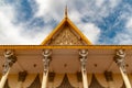 Phnom Penh Cambodian Royal Palace - looking up at statues in roof detailing - in colour