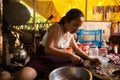 Image of a Khmer rural women girl in the countryside cooking in Cambodia.