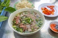 Pho beef noodles soup served with vegetables and bean sprouts Royalty Free Stock Photo
