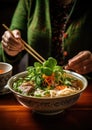 Pho Bo traditional Soup with beef, rice noodles, ginger, lime, chili pepper in bowl. Vietnamese and Asian cuisine.