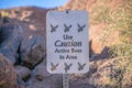 Phoenix, Arizona- Close-up of a signage with Use Caution Active Bees In Area at Camelback Mountain Royalty Free Stock Photo