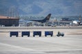Phoenix, Arizona, USA - November 4, 2022: Baggage tractor hauling luggage across airport tarmac