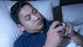 Phone Addicted, Man Using Smart Phone on Bed at Midnight