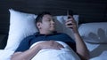 Phone Addicted, Man Using Smart Phone on Bed at Midnight