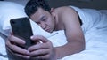 Phone Addicted, Man Using Smart Phone on Bed at Midnight