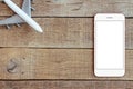 Phone and airplane toy on wood table transport business concept Royalty Free Stock Photo