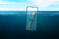 Phone as a message in a bottle in the sea concept. Phone floats at sea Royalty Free Stock Photo