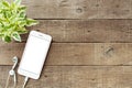 Phone blank white screen on old wood table Royalty Free Stock Photo