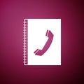 Phone book icon isolated on purple background. Address book. Telephone directory Royalty Free Stock Photo