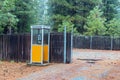 Phone booth in a pine forest near East Quincy, California, USA - November 24, 2017 Royalty Free Stock Photo