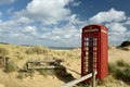 Phone box on beach at Studland Bay near Swanage in Dorset Royalty Free Stock Photo