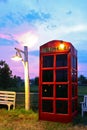 Phone box at side of field on twilight time