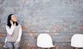 Phone call, chairs and Asian woman in interview waiting room with smartphone, recruitment and employment with smile