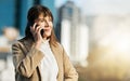 Phone call, city and senior business woman standing in street talking, listening and in conversation on smartphone Royalty Free Stock Photo